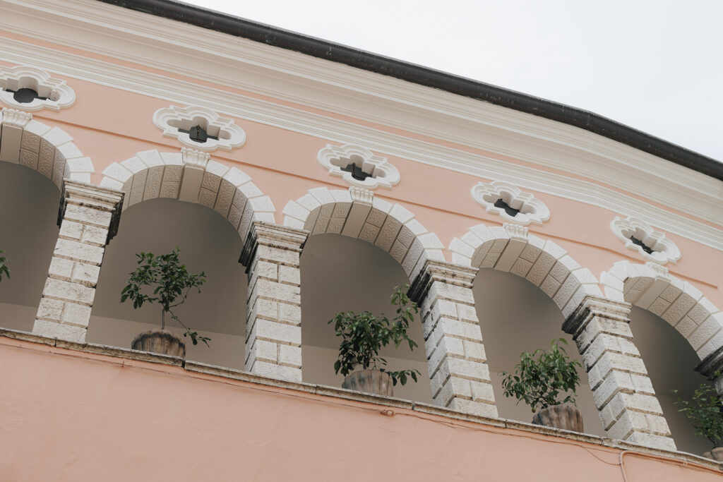 salmon-colored house in Limone